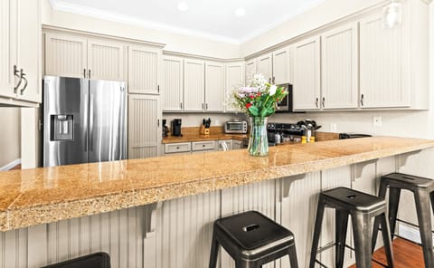 Your gourmet kitchen awaits with gleaming granite counters.