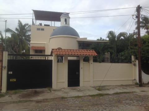 Home with casita on top of the home. Back spiral stairs save entrance.