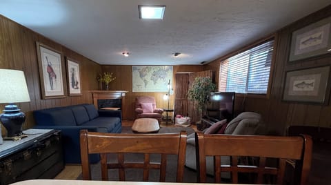 Cozy living room with pull out queen bed, electric fireplace, TV, 2 recliners