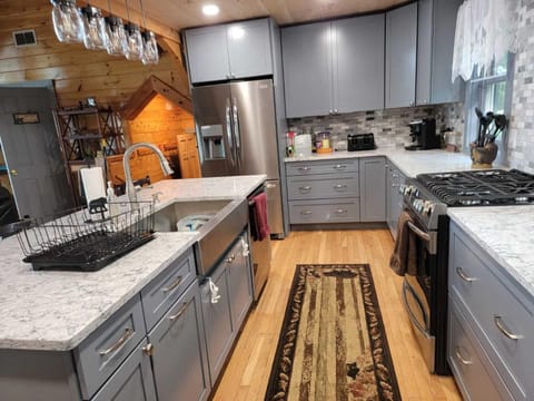 Large spacious kitchen with lots of cabinets and two ovens!