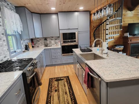 Large spacious kitchen with lots of cabinets and two ovens!
