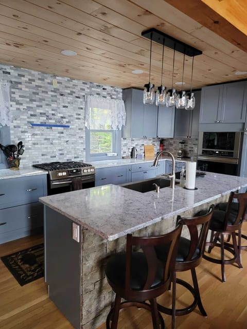 Large spacious kitchen with lots of cabinets and two ovens!