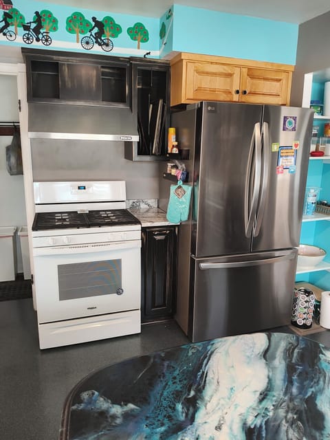 Gas range.  Full refrigerator with internal ice and filtered water dispenser.