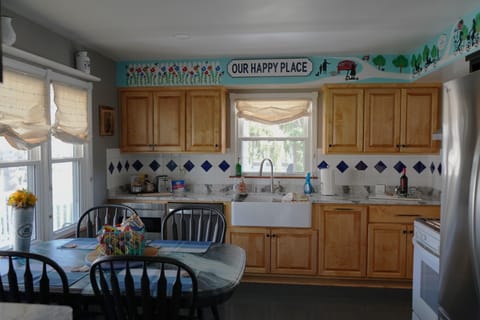 Fully stocked kitchen is a special gathering space to laugh and enjoy a meal.