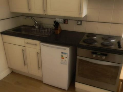 Fully equipped kitchen with crockery, glasses, kettle, microwave etc.