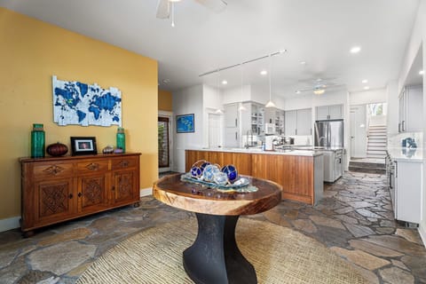 Natural light fills this casual dining space with seamless access to the kitchen and lanai.