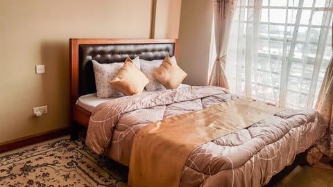 Queen size bed with orthopedic mattress.