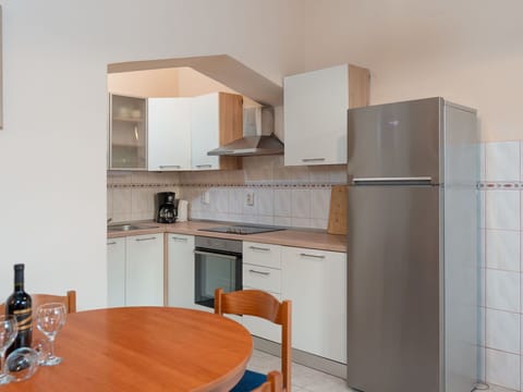 Furniture, Interior Design, Kitchen Appliance, Kitchen, Major Appliance, Flooring, Wood, Countertop, Floor, Cabinetry