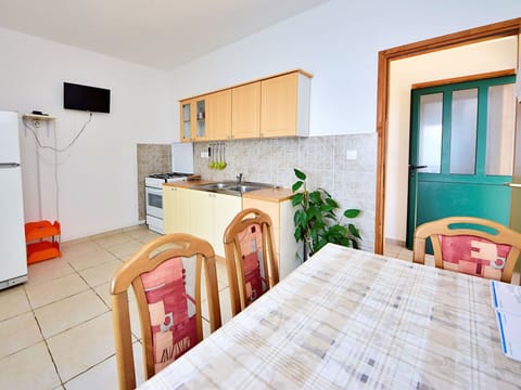 Furniture, Property, Cabinetry, Table, Wood, Countertop, Chair, Interior Design, Kitchen Stove, Flooring