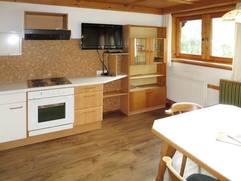 Countertop, Furniture, Room, Cabinetry, Property, Kitchen, Floor, Interior Design, Wood Flooring, Building