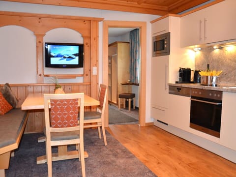 Wood, Interior Design, Furniture, Apartment, Room, Living Room, Ceiling, Wood Stain, Television, Chair