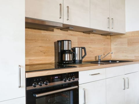 Cabinetry, Property, Countertop, Kitchen Sink, Kitchen Stove, Tap, Wood, Kitchen Appliance, Kitchen, Cooktop