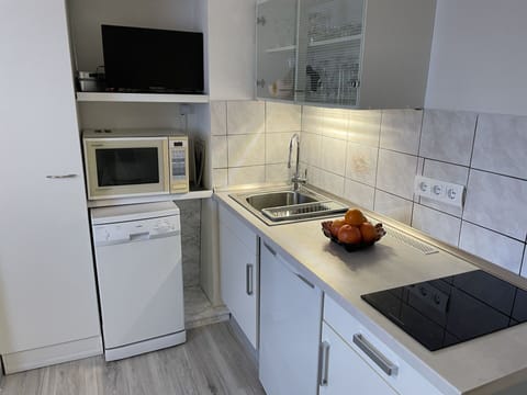 Cabinetry, Property, Countertop, Furniture, Kitchen Appliance, Kitchen Stove, Gas Stove, Cooktop, Kitchen Sink, Kitchen