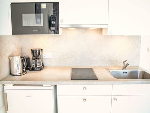 Countertop, Kitchen, Cabinetry, Kitchen Appliance, Kitchen Sink, Interior Design, Plumbing Fixture, Sink, Tap, Major Appliance