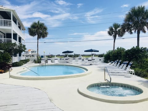 View of the pool and hot tub towards the Gulf.