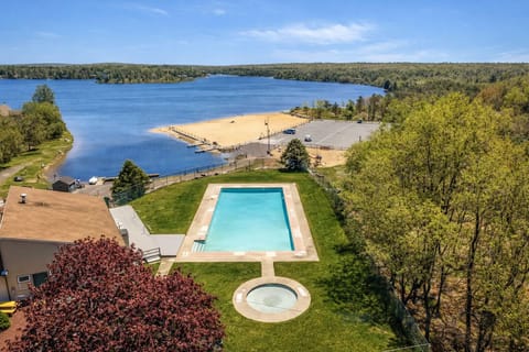 Community pool overlooking the lake (seasonal) 8min walk from house 0.4mi