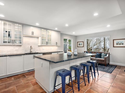 Moroccan inspired ceramic backsplash mixes old world with contemporary design.  