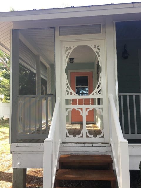 Screened porch with table and four chairs. Perfect for breakfast or dinner.