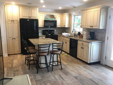 Kitchen-refrigerator with ice maker, stove,dishwasher,microwave & coffee maker.