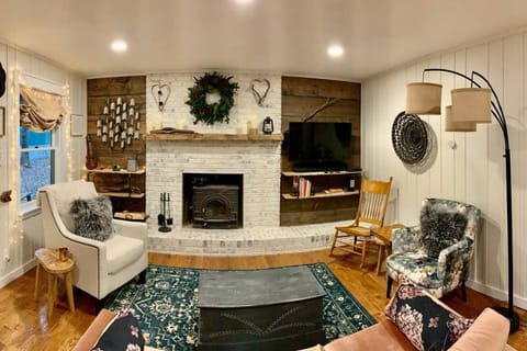 Relax in the warm and comfy living area - complete with wood-burning stove.