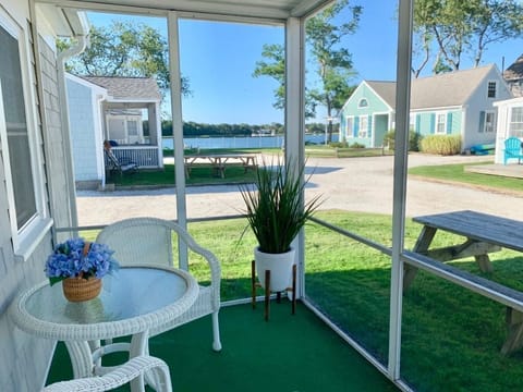 Screened-in porch with view of Bass River