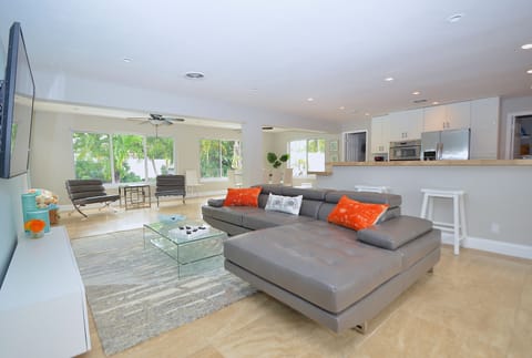 Open Living Features Leather Sectional + 65" 4K Smart TV + Leather Chairs...