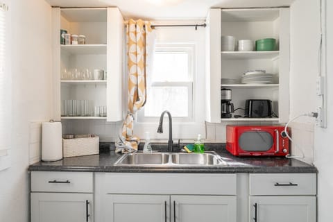 First Floor | Kitchenette supplied with dishes, cookware and cutlery