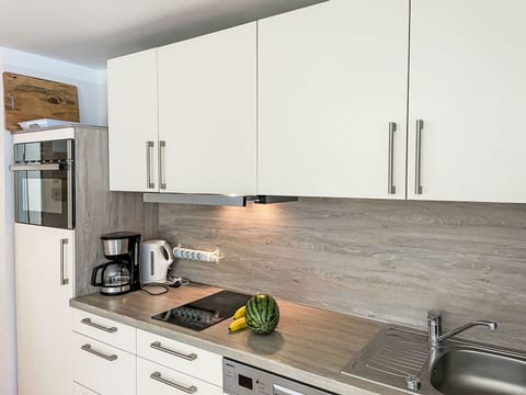 Countertop, Kitchen, Flooring, Cabinetry, Wood, Kitchen Appliance, Interior Design, Furniture, Floor, Home Appliance