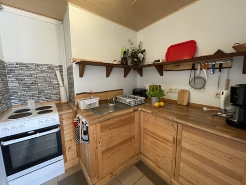 Countertop, Cabinetry, Property, Kitchen Appliance, Kitchen Stove, Kitchen, Gas Stove, Home Appliance, Wood, Interior Design