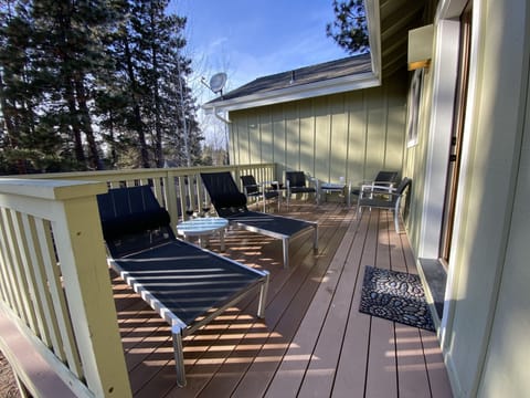 One of two deck spaces, furnished with top-notch loungers, chairs, and tables. 