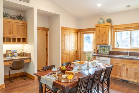 Dining and desk area. Large deck just outside, and access to the garage.