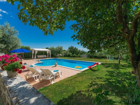 Water, Plant, Swimming Pool, Sky, Tree, Outdoor Furniture, Shade, Building, Chair, Leisure