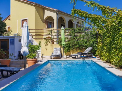 Water, Plant, Swimming Pool, Blue, Sky, Azure, Building, Body Of Water, Outdoor Furniture, Shade