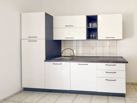 Cabinetry, Flooring, Cupboard, Interior Design, Floor, Drawer, Furniture, Countertop, Home, Kitchen