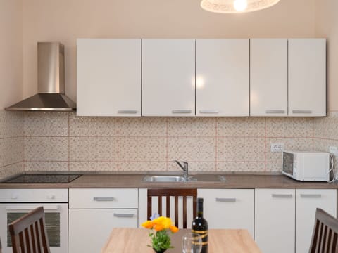 Kitchen, Countertop, Kitchen Appliance, Cabinetry, Major Appliance, Interior Design, Wood, Furniture, Flooring, Sink