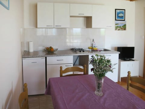 Furniture, Cabinetry, Table, Countertop, Building, Kitchen Appliance, Kitchen, Chair, Kitchen Stove, Home Appliance