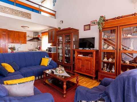 Furniture, Picture Frame, Couch, Living Room, Orange, Interior Design, Shelf, Bookcase, Table, Comfort