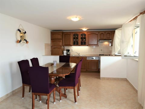 Table, Furniture, Cabinetry, Property, Countertop, Chair, Wood, Interior Design, Architecture, Kitchen & Dining Room Table