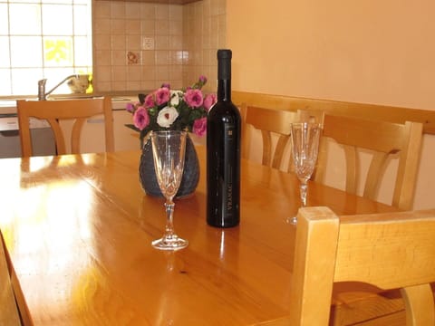 Flower, Tableware, Table, Furniture, Bottle, Stemware, Drinkware, Plant, Window, Vase