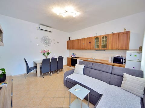 Furniture, Houseplant, Interior Design, Table, Couch, Floor, Flooring, Living Room, Plant, Television