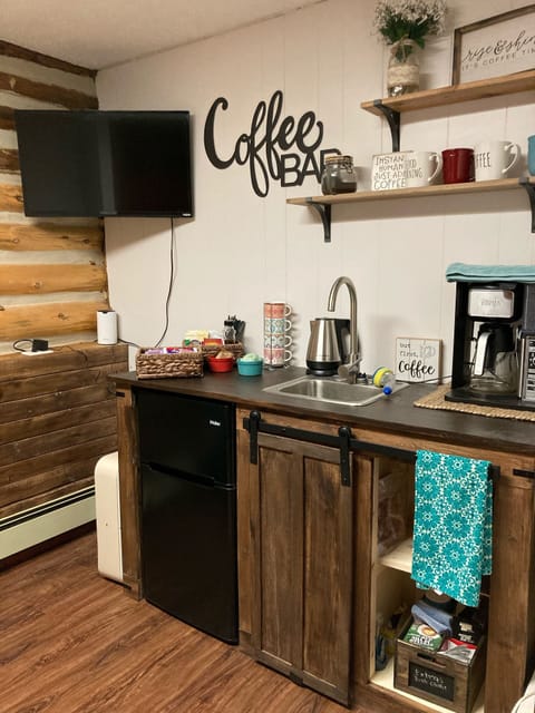 Coffee/bedroom with 10 cup coffee maker, electric kettle, teas and mini fridge.