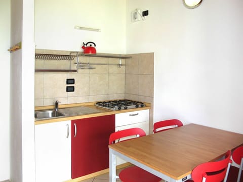 Cabinetry, Furniture, Property, Countertop, Kitchen Stove, Kitchen Appliance, Sink, Building, Wood, Interior Design