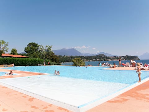 Sky, Water, Swimming Pool, Azure, Mountain, Tree, Leisure, Resort Town, Shade, Recreation