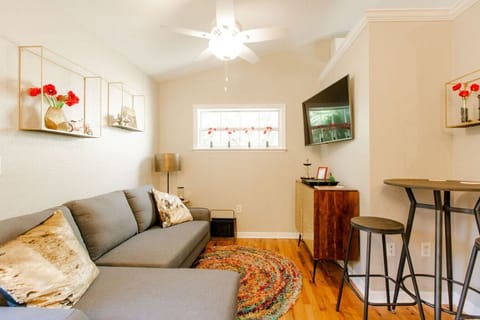 Comfy living room with big screen tv and dinette table with two chairs