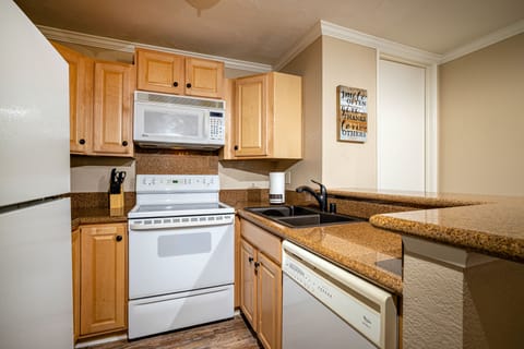 The kitchen has a wood-look floor and is ready for the chef in your party!