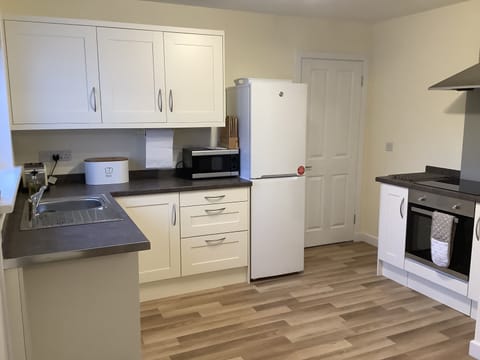 Kitchen has fridge freezer, dishwasher, oven and hob