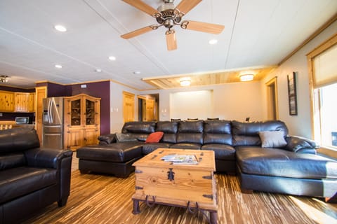 The living room has plenty of seating and a pull out sofa bed