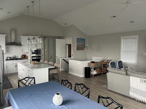 Living, kitchen, grill, deck, primary bedroom on top floor