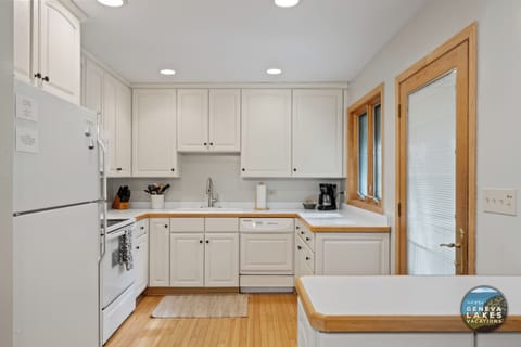 View of kitchen and entrance to home