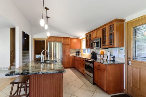 Fully equipped kitchen with electric stove, drip coffee maker